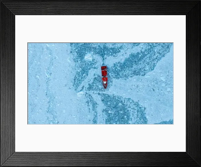 Framed Print : Aerial of a little ship floating between the ice below the Eqi glacier, Western Greenland, Denmark, Polar Regions Framed Print : Aerial of a little ship floating between the ice below the Eqi glacier, Western Greenland, Denmark, Polar Regions