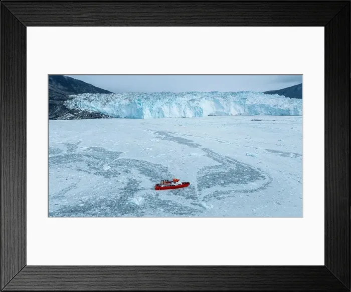 Framed Print : Aerial of a little ship floating between the ice below the Eqi glacier, Western Greenland, Denmark, Polar Regions Framed Print : Aerial of a little ship floating between the ice below the Eqi glacier, Western Greenland, Denmark, Polar Regions