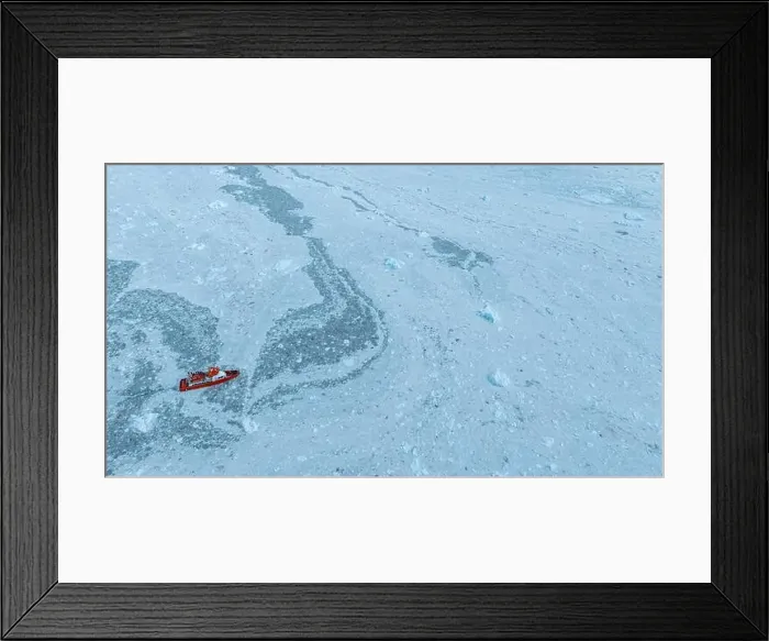 Framed Print : Aerial of a little ship floating between the ice below the Eqi glacier, Western Greenland, Denmark, Polar Regions Framed Print : Aerial of a little ship floating between the ice below the Eqi glacier, Western Greenland, Denmark, Polar Regions