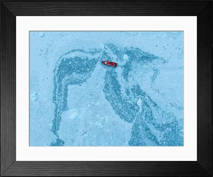 Framed Print : Aerial of a little ship floating between the ice below the Eqi glacier, Western Greenland, Denmark, Polar Regions Framed Print : Aerial of a little ship floating between the ice below the Eqi glacier, Western Greenland, Denmark, Polar Regions