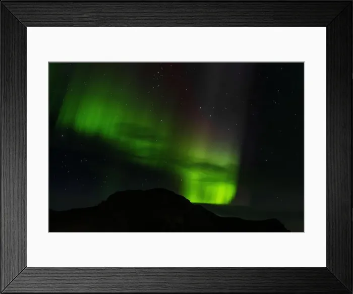 Framed Print : Northern lights above a montaga in the city of Vik, Iceland Framed Print : Northern lights above a montaga in the city of Vik, Iceland