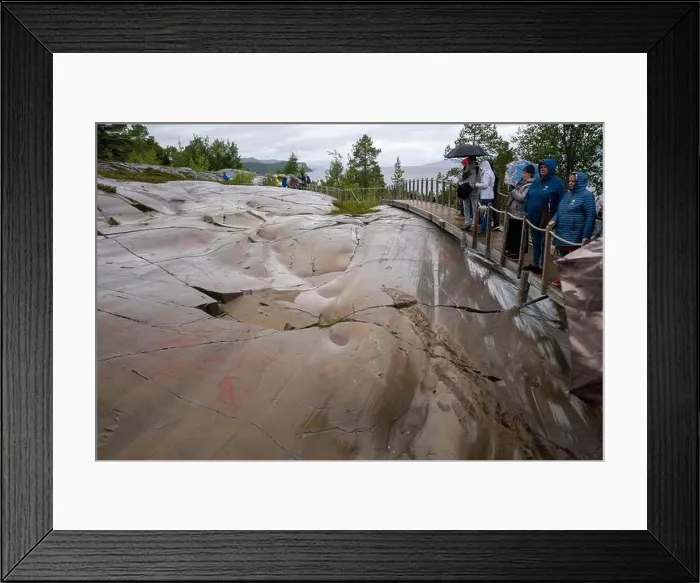 Framed Print : Alta, Norway - 07.03.2024: Tourists viewing the Rock Art of Alta in Norway Framed Print : Alta, Norway - 07.03.2024: Tourists viewing the Rock Art of Alta in Norway
