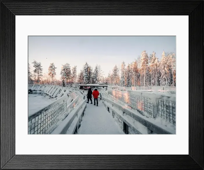 Framed Print : Couple walking over wooden footpath next to enclosures in wildlife park, Ranua Framed Print : Couple walking over wooden footpath next to enclosures in wildlife park, Ranua