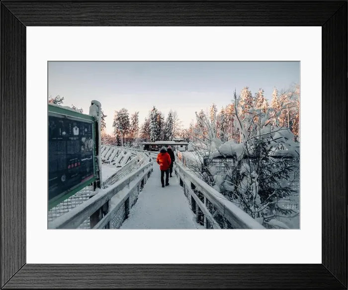 Framed Print : Couple walking over snowy bridge in wildlife in Ranua, Lapland Framed Print : Couple walking over snowy bridge in wildlife in Ranua, Lapland