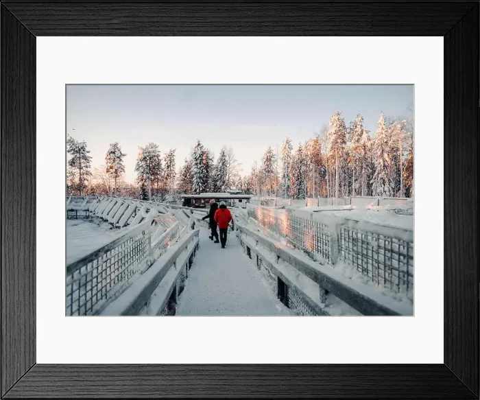 Framed Print : Couple walking over snowy footbridge in wildlife park in Ranua, Lapland Framed Print : Couple walking over snowy footbridge in wildlife park in Ranua, Lapland