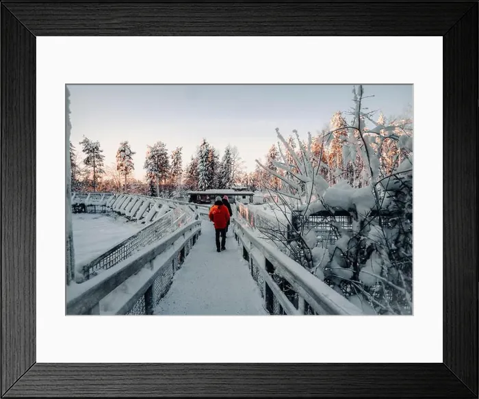 Framed Print : Couple walking over footbridge in wildlife park in Ranua, Lapland Framed Print : Couple walking over footbridge in wildlife park in Ranua, Lapland