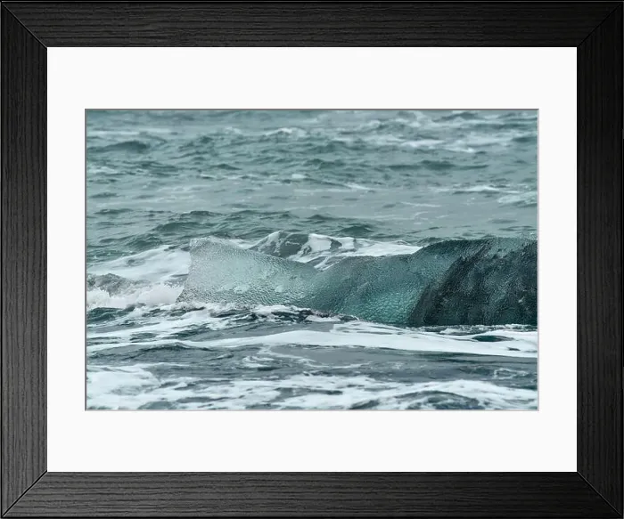 Framed Print : This piece of iceberg looks like a humpback whale's tail fin above the ocean surface. Location: Diamond Beach Iceland Framed Print : This piece of iceberg looks like a humpback whale's tail fin above the ocean surface. Location: Diamond Beach Iceland