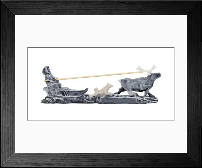 Framed Print : Evenk rides a reindeer sled with a dog running alongside. Miniature figurine, souvenir. Isolated on white background Framed Print : Evenk rides a reindeer sled with a dog running alongside. Miniature figurine, souvenir. Isolated on white background