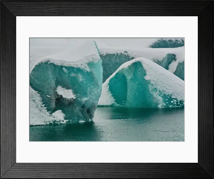 Framed Print : Glacial icebergs with intricate textures floating in cold arctic waters Framed Print : Glacial icebergs with intricate textures floating in cold arctic waters