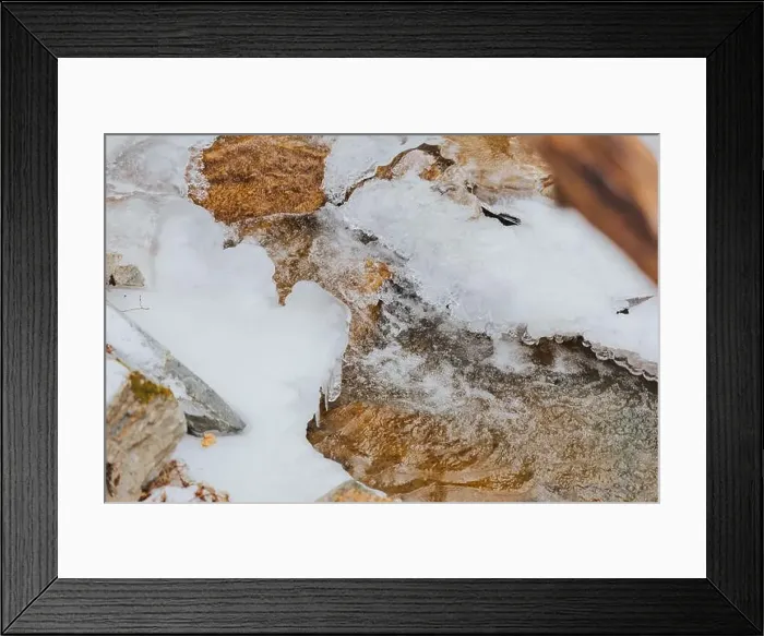 Framed Print : A peaceful snow-covered woods with a charming stream Framed Print : A peaceful snow-covered woods with a charming stream