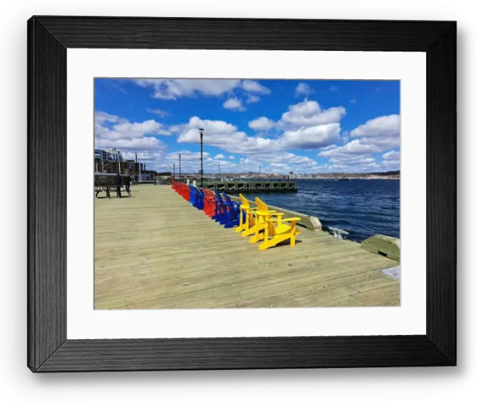 Framed Print : Row of colorful Adirondack chairs at the waterfront boardwalk in Halifax, Nova Scotia, Canada Framed Print : Row of colorful Adirondack chairs at the waterfront boardwalk in Halifax, Nova Scotia, Canada