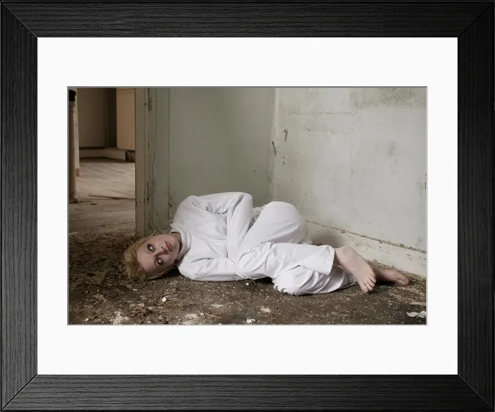 Framed Print : Girl in a straight-jacket inside an abandoned house Framed Print : Girl in a straight-jacket inside an abandoned house