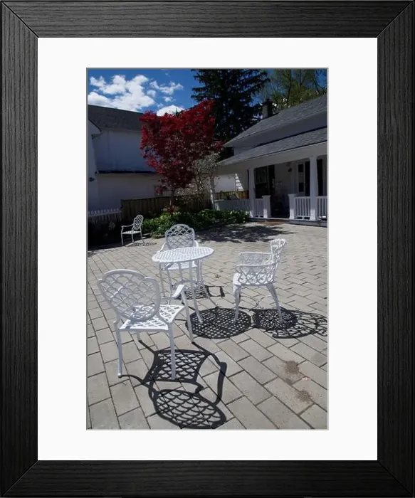 Framed Print : Light and shadow of the white coloured chairs and table Framed Print : Light and shadow of the white coloured chairs and table