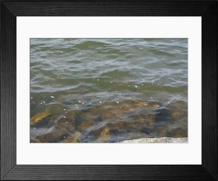 Framed Print : Large stones, brown and gray granite are located on the shore and bottom of the reservoir Framed Print : Large stones, brown and gray granite are located on the shore and bottom of the reservoir