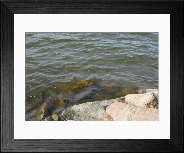 Framed Print : Large stones, brown and gray granite are located on the shore and bottom of the reservoir Framed Print : Large stones, brown and gray granite are located on the shore and bottom of the reservoir