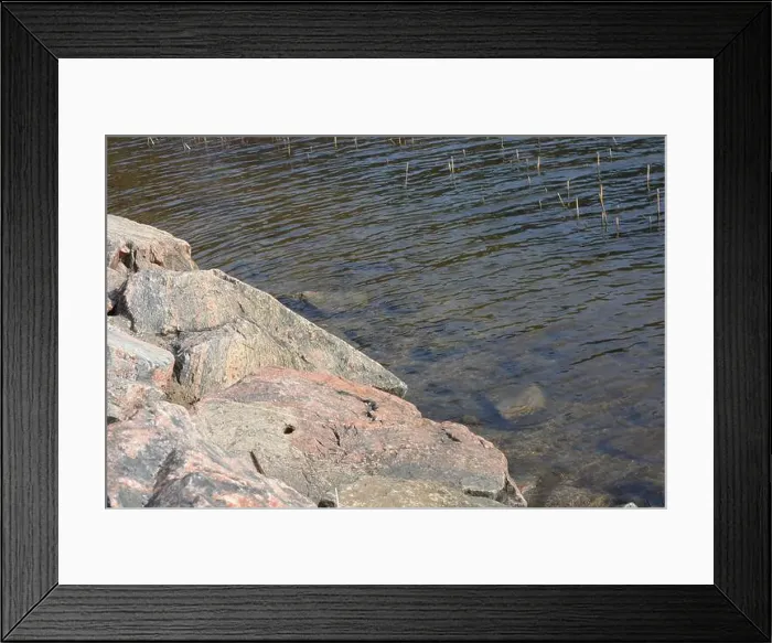 Framed Print : Large stones, brown and gray granite are located on the shore and bottom of the reservoir Framed Print : Large stones, brown and gray granite are located on the shore and bottom of the reservoir