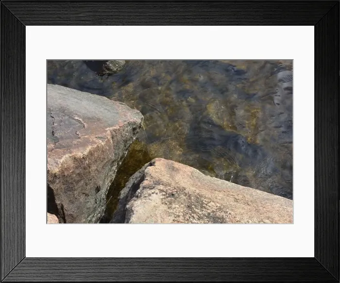 Framed Print : Large stones, brown and gray granite are located on the shore and bottom of the reservoir Framed Print : Large stones, brown and gray granite are located on the shore and bottom of the reservoir