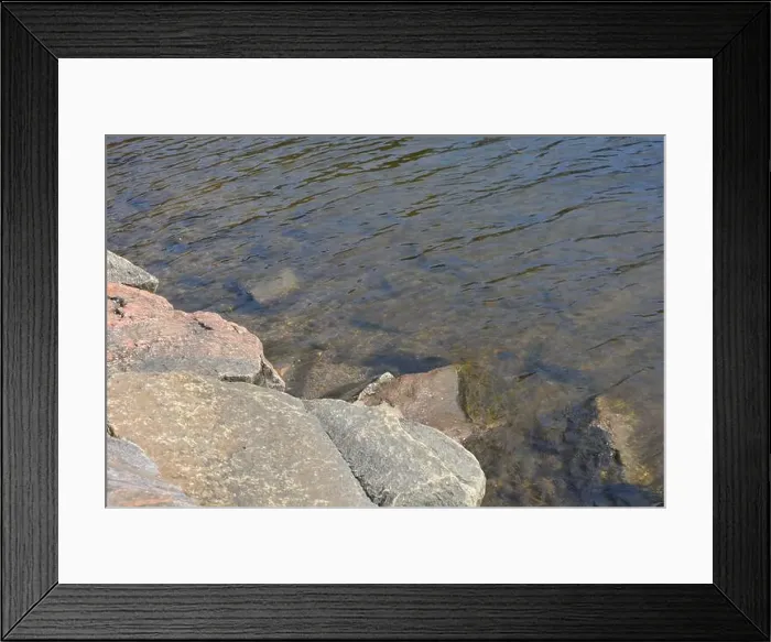 Framed Print : Large stones, brown and gray granite are located on the shore and bottom of the reservoir Framed Print : Large stones, brown and gray granite are located on the shore and bottom of the reservoir