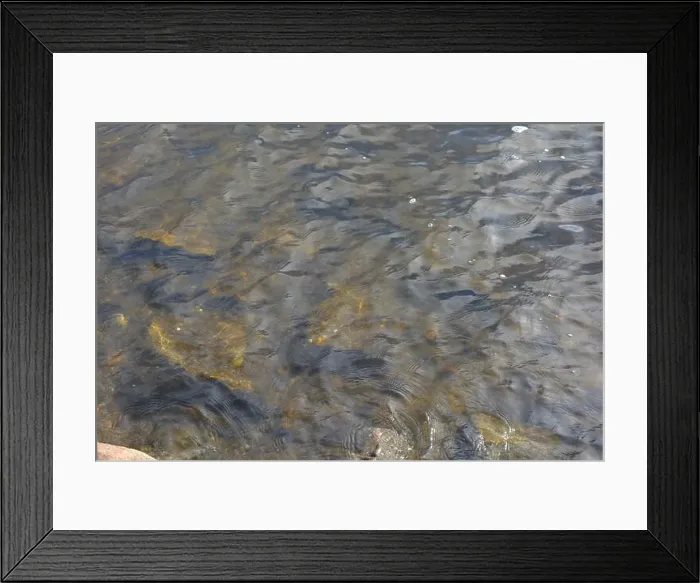 Framed Print : Large stones, brown and gray granite are located on the shore and bottom of the reservoir Framed Print : Large stones, brown and gray granite are located on the shore and bottom of the reservoir