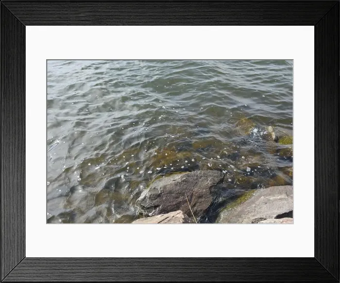 Framed Print : Large stones, brown and gray granite are located on the shore and bottom of the reservoir Framed Print : Large stones, brown and gray granite are located on the shore and bottom of the reservoir