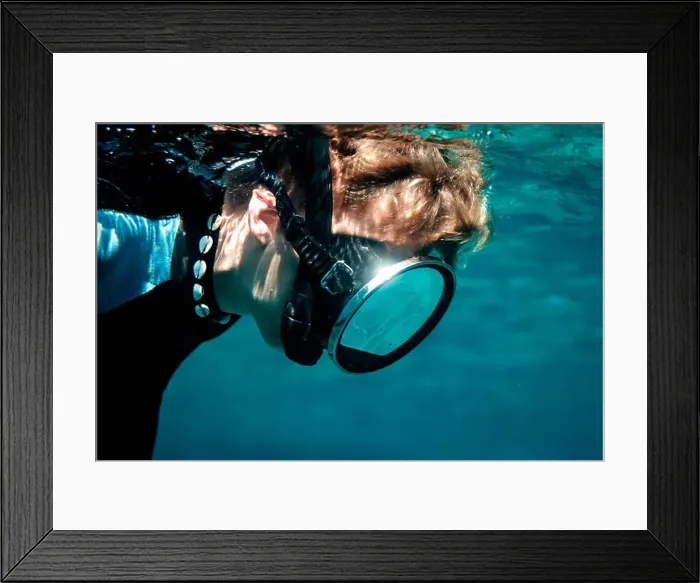 Framed Print : An underwater view of a diver holding a large magnifying glass to observe local fish species in Menorca, Spain Framed Print : An underwater view of a diver holding a large magnifying glass to observe local fish species in Menorca, Spain