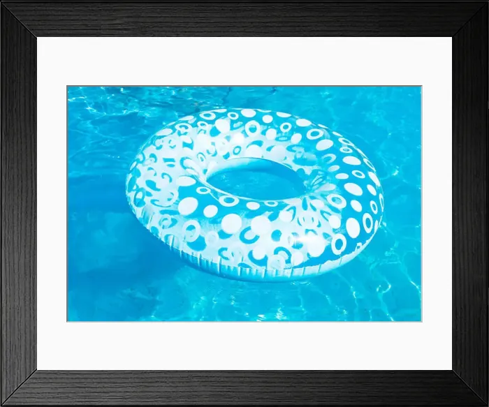 Framed Print : inflatable swimming circle in blue open-air pool in summer day Framed Print : inflatable swimming circle in blue open-air pool in summer day
