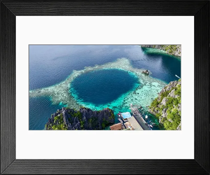 Framed Print : An incredible aerial view of a pristine coral lagoon with vibrant turquoise and deep blue waters Framed Print : An incredible aerial view of a pristine coral lagoon with vibrant turquoise and deep blue waters