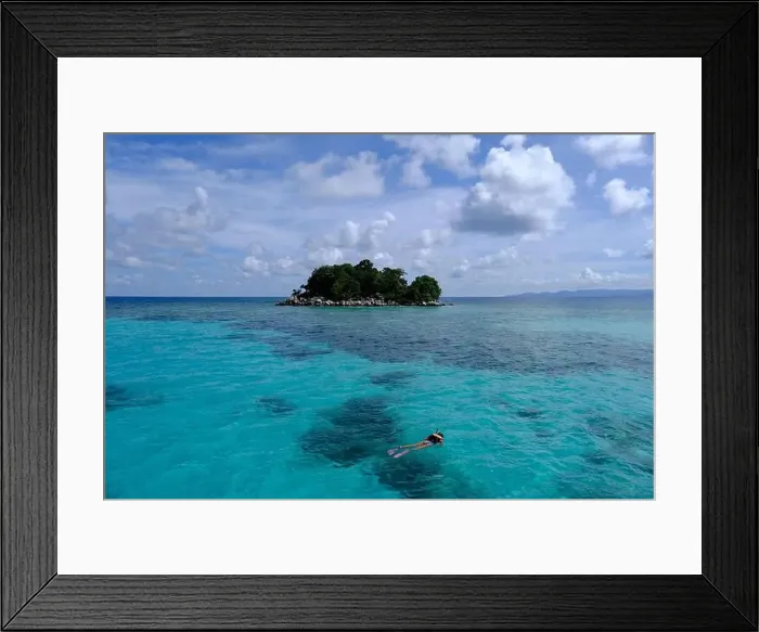 Framed Print : Indonesia Anambas Islands - Female snorkeller in coral reef Framed Print : Indonesia Anambas Islands - Female snorkeller in coral reef