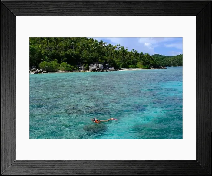 Framed Print : Indonesia Anambas Islands - Female snorkeller in coral reef Framed Print : Indonesia Anambas Islands - Female snorkeller in coral reef