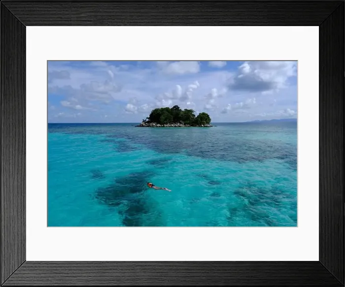 Framed Print : Indonesia Anambas Islands - Female snorkeller in coral reef Framed Print : Indonesia Anambas Islands - Female snorkeller in coral reef