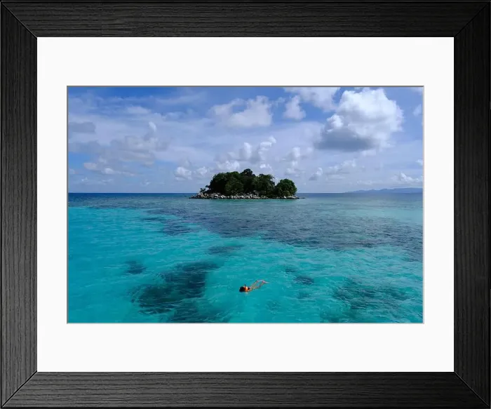 Framed Print : Indonesia Anambas Islands - Female snorkeller in coral reef Framed Print : Indonesia Anambas Islands - Female snorkeller in coral reef