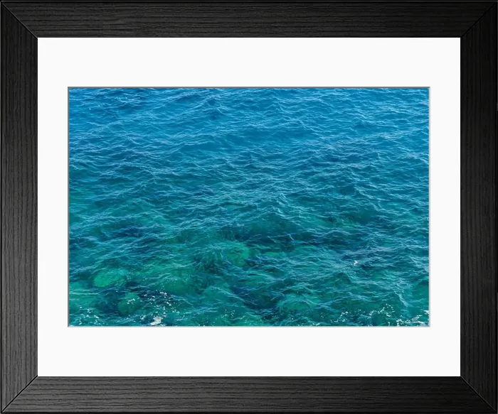 Framed Print : Gentle waves lapping against each other, reflecting sunlight in varying shades of blue and green Framed Print : Gentle waves lapping against each other, reflecting sunlight in varying shades of blue and green