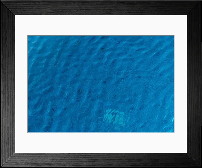 Framed Print : The tranquil turquoise waters gently undulate under the sun Framed Print : The tranquil turquoise waters gently undulate under the sun