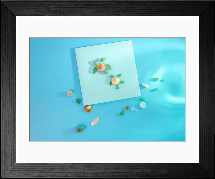 Framed Print : Creative representation of turtle crafted from seashells and glass fragments on blue sea-like background Framed Print : Creative representation of turtle crafted from seashells and glass fragments on blue sea-like background