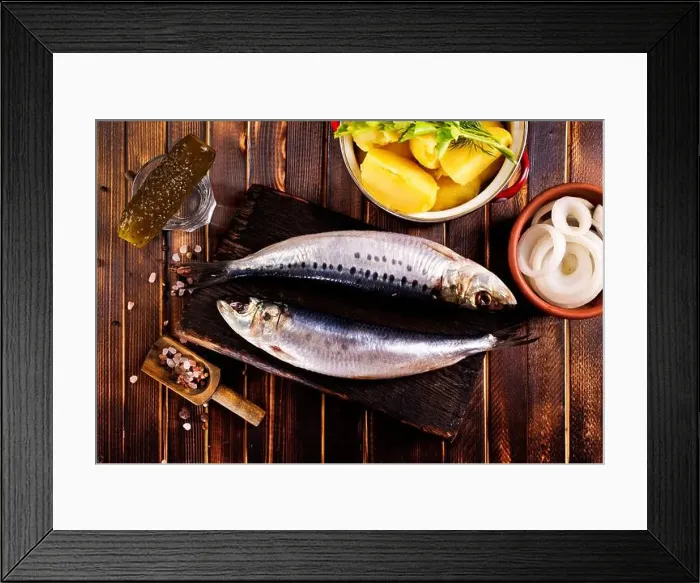 Framed Print : Herring or Baltic herring with salt on dark backgruond Framed Print : Herring or Baltic herring with salt on dark backgruond