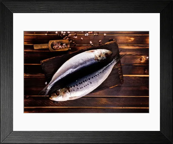Framed Print : Herring or Baltic herring with salt on dark backgruond Framed Print : Herring or Baltic herring with salt on dark backgruond