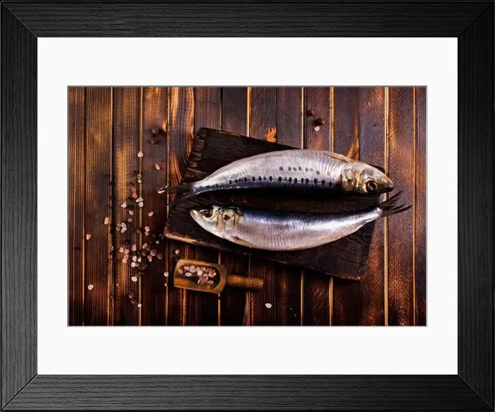 Framed Print : Herring or Baltic herring with salt on dark backgruond Framed Print : Herring or Baltic herring with salt on dark backgruond