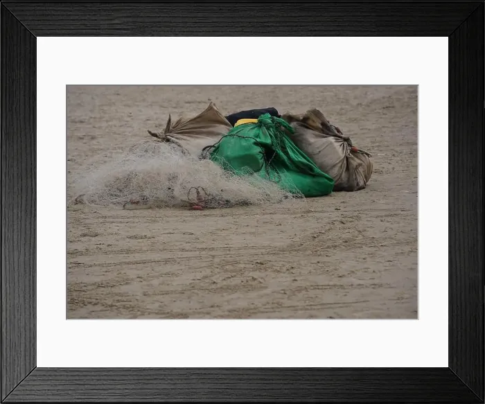Framed Print : Plastic carrier bags and fishing nets on candy beach
