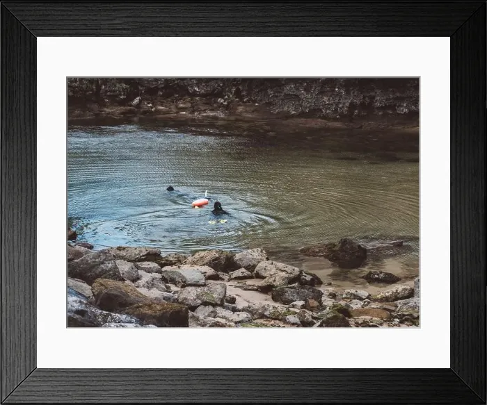 Framed Print : Pair of scuba divers can be seen with their gear Framed Print : Pair of scuba divers can be seen with their gear