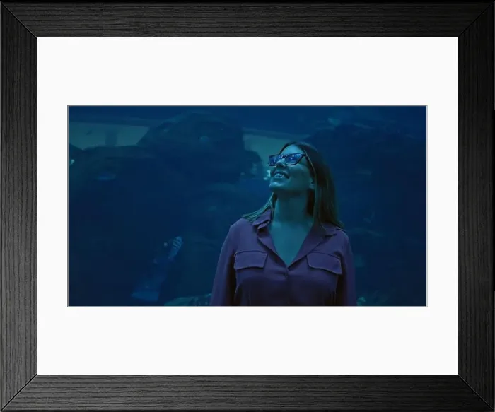 Framed Print : A smiling young adult woman experiences the marine wonders at an aquarium in dubai Framed Print : A smiling young adult woman experiences the marine wonders at an aquarium in dubai