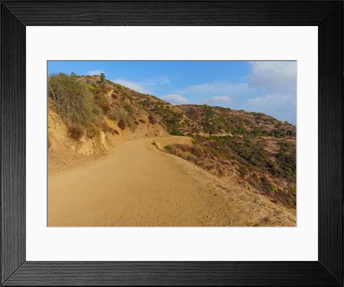 Framed Print : Curved dirt path winding through the hills of Griffith Park, showcasing the natural beauty and vegetation of the area Framed Print : Curved dirt path winding through the hills of Griffith Park, showcasing the natural beauty and vegetation of the area