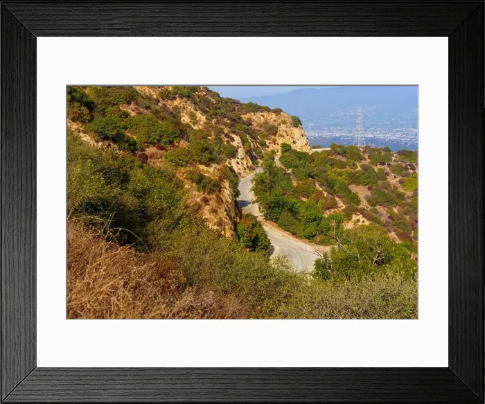 Framed Print : Close-up view of a winding road surrounded by dense vegetation in Griffith Park Framed Print : Close-up view of a winding road surrounded by dense vegetation in Griffith Park