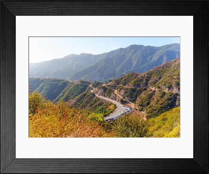 Framed Print : Breathtaking view of a winding mountain road surrounded by lush greenery in La Canada Flintridge Framed Print : Breathtaking view of a winding mountain road surrounded by lush greenery in La Canada Flintridge