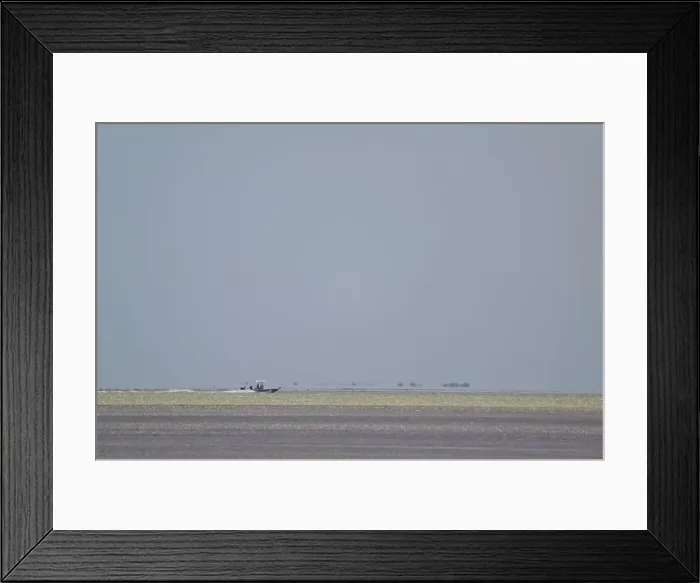 Framed Print : Fishing boat on the sea with grey sky seen towards Florida Keys