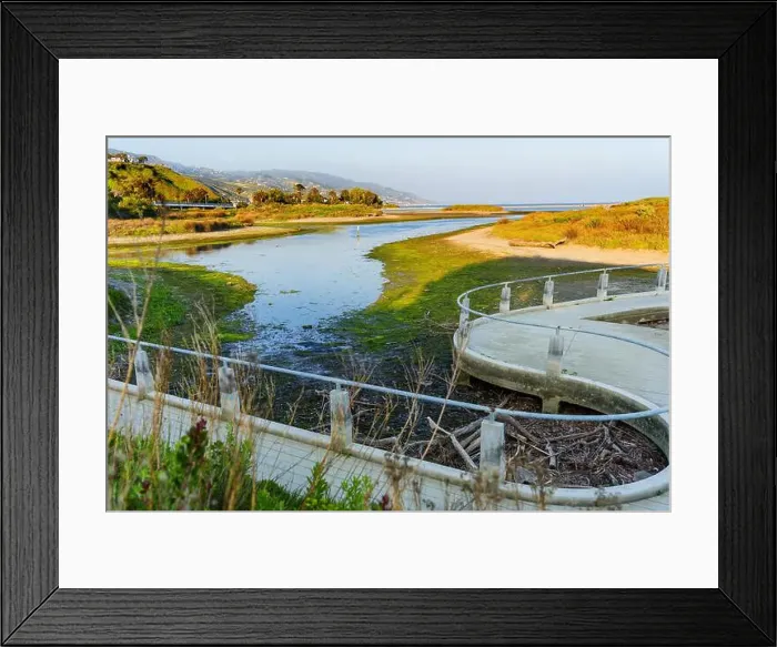 Framed Print : Winding walkway alongside Malibu Lagoon featuring lush greenery and tranquil water. Coastal California landscape Framed Print : Winding walkway alongside Malibu Lagoon featuring lush greenery and tranquil water. Coastal California landscape