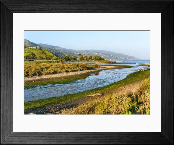 Framed Print : View of flowing waters in Malibu Lagoon surrounded by lush greenery and hills on a sunny day in spring Framed Print : View of flowing waters in Malibu Lagoon surrounded by lush greenery and hills on a sunny day in spring