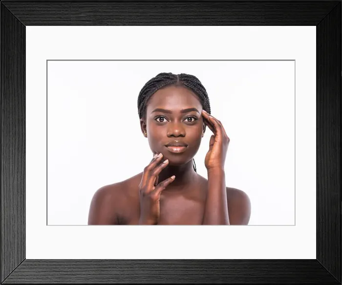 Framed Print : Beautiful african woman face close up portrait on white background Framed Print : Beautiful african woman face close up portrait on white background