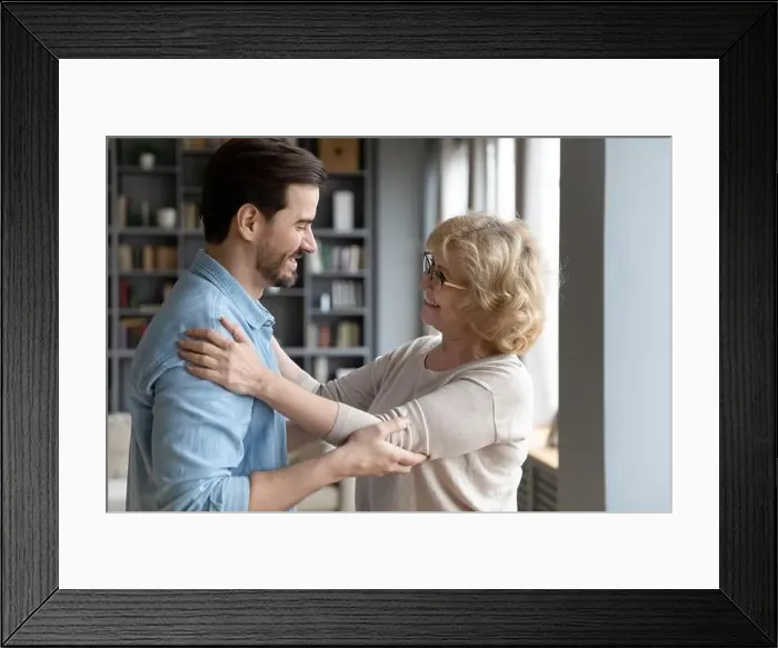 Framed Print : Elderly mother admires matured son looking at him enjoy meeting Framed Print : Elderly mother admires matured son looking at him enjoy meeting