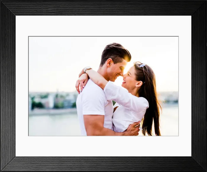 Framed Print : Young romantic couple hugging and about to kiss in beautiful sunset Framed Print : Young romantic couple hugging and about to kiss in beautiful sunset