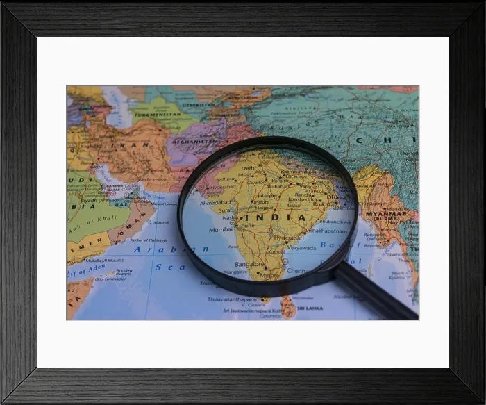 Framed Print : India map through magnifying glass on a world map